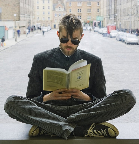Student reading in the Hub, Main Library.